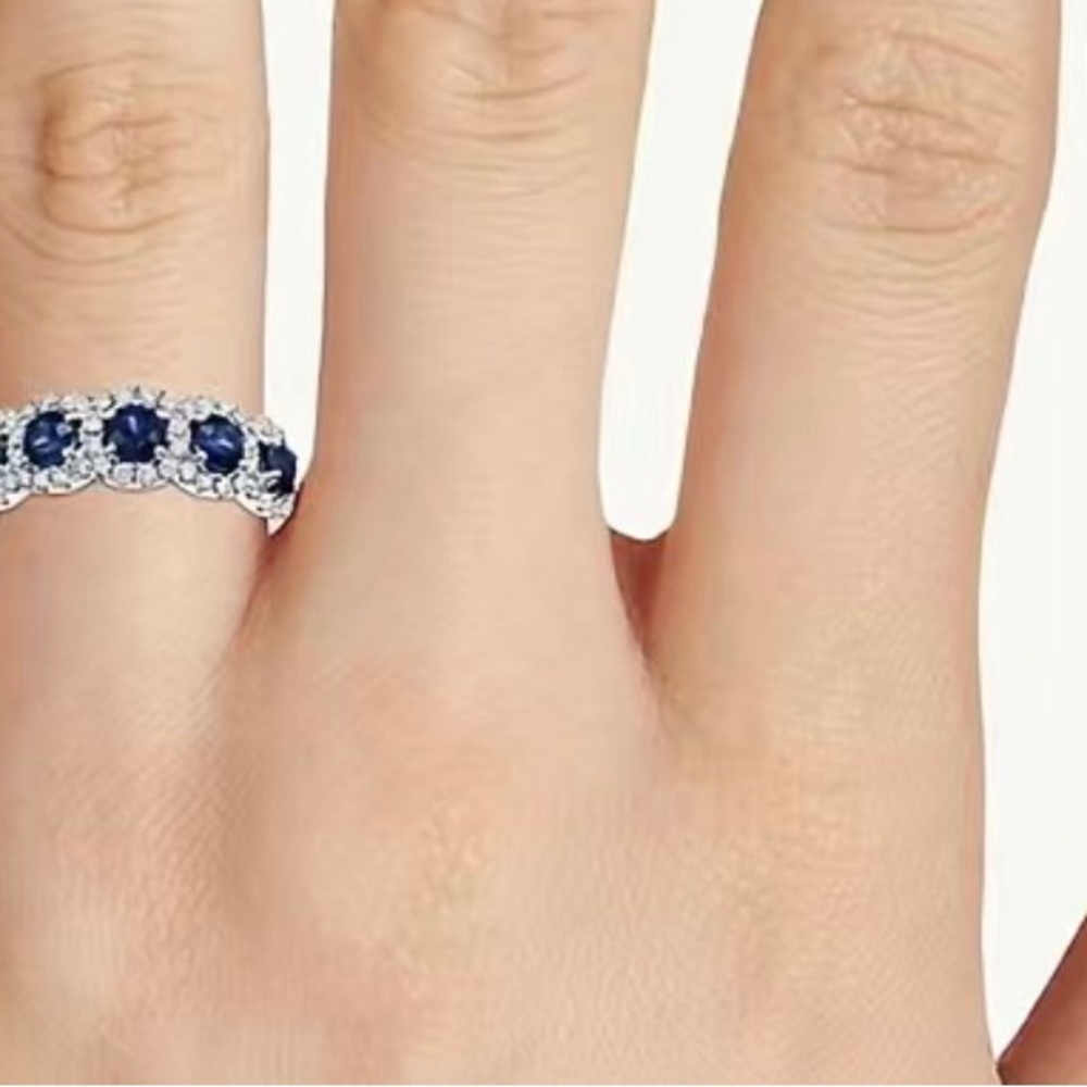 This beautiful created, sapphire and diamond ring, set in white gold. Size 6.